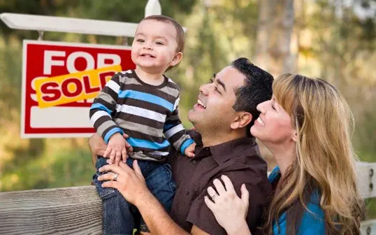 Happy family celebrating new home purchase.